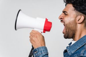 yelling into a megaphone qujam geofencing call to action image